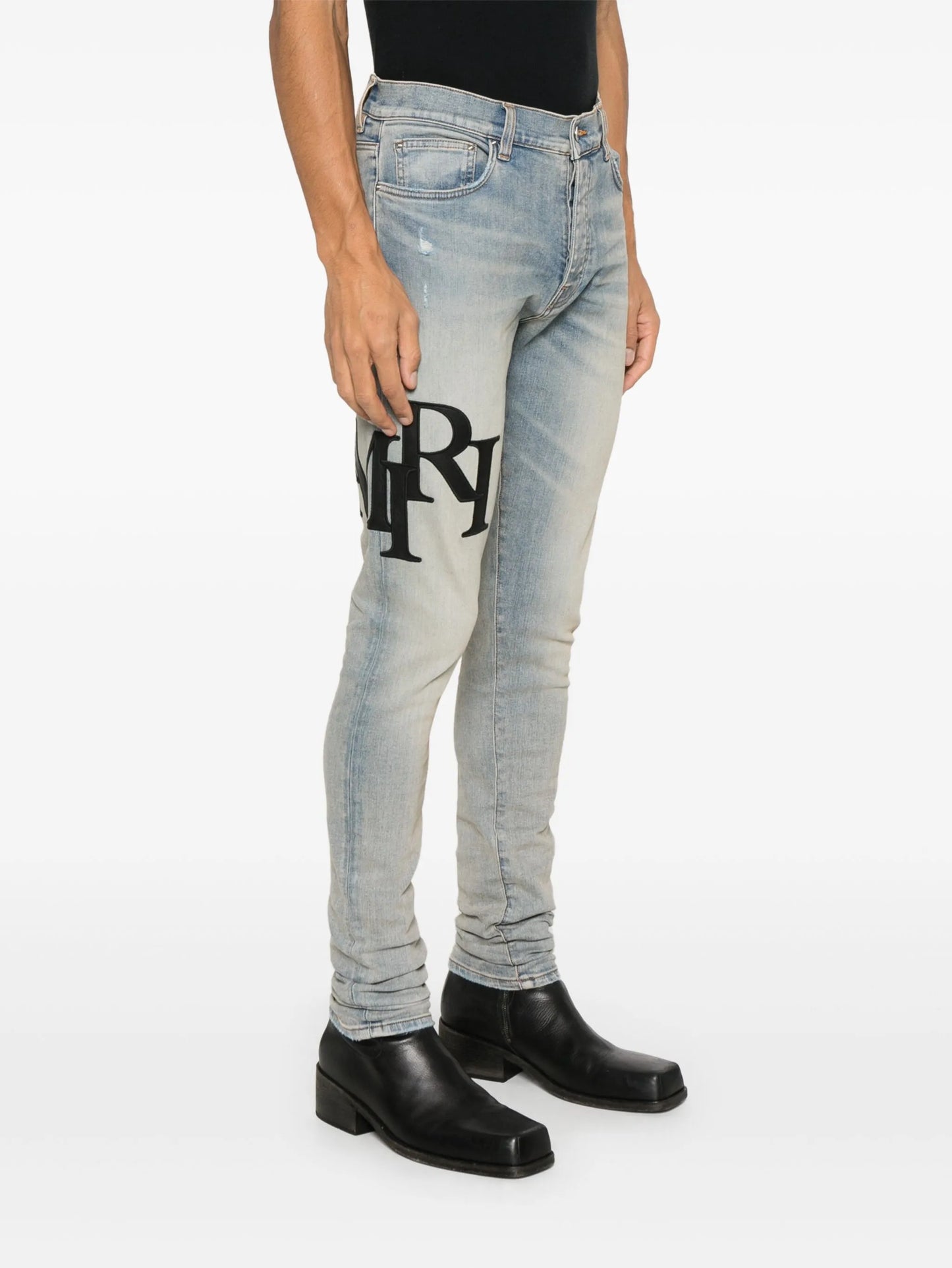 Staggered logo skinny jeans