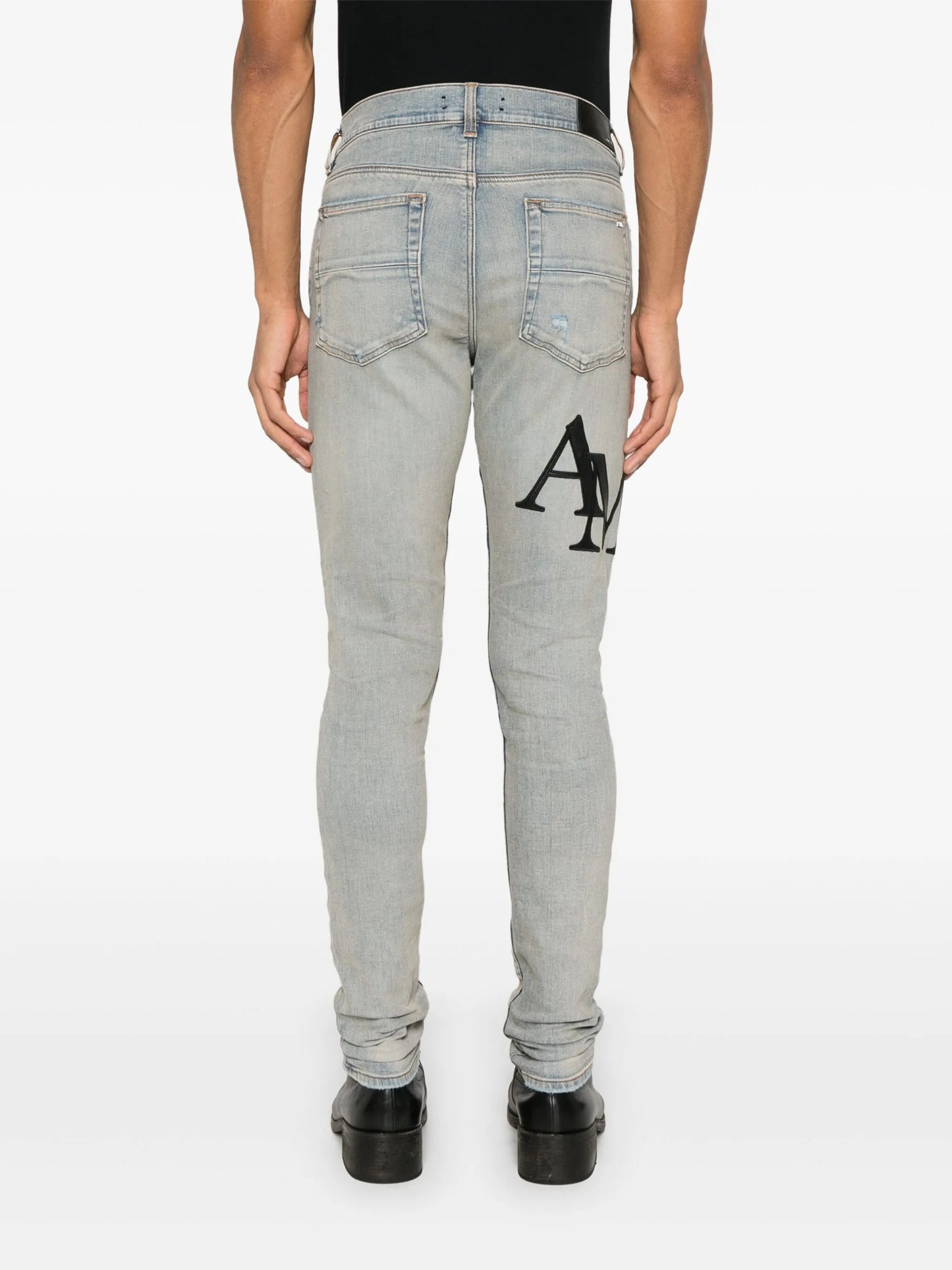 Staggered logo skinny jeans