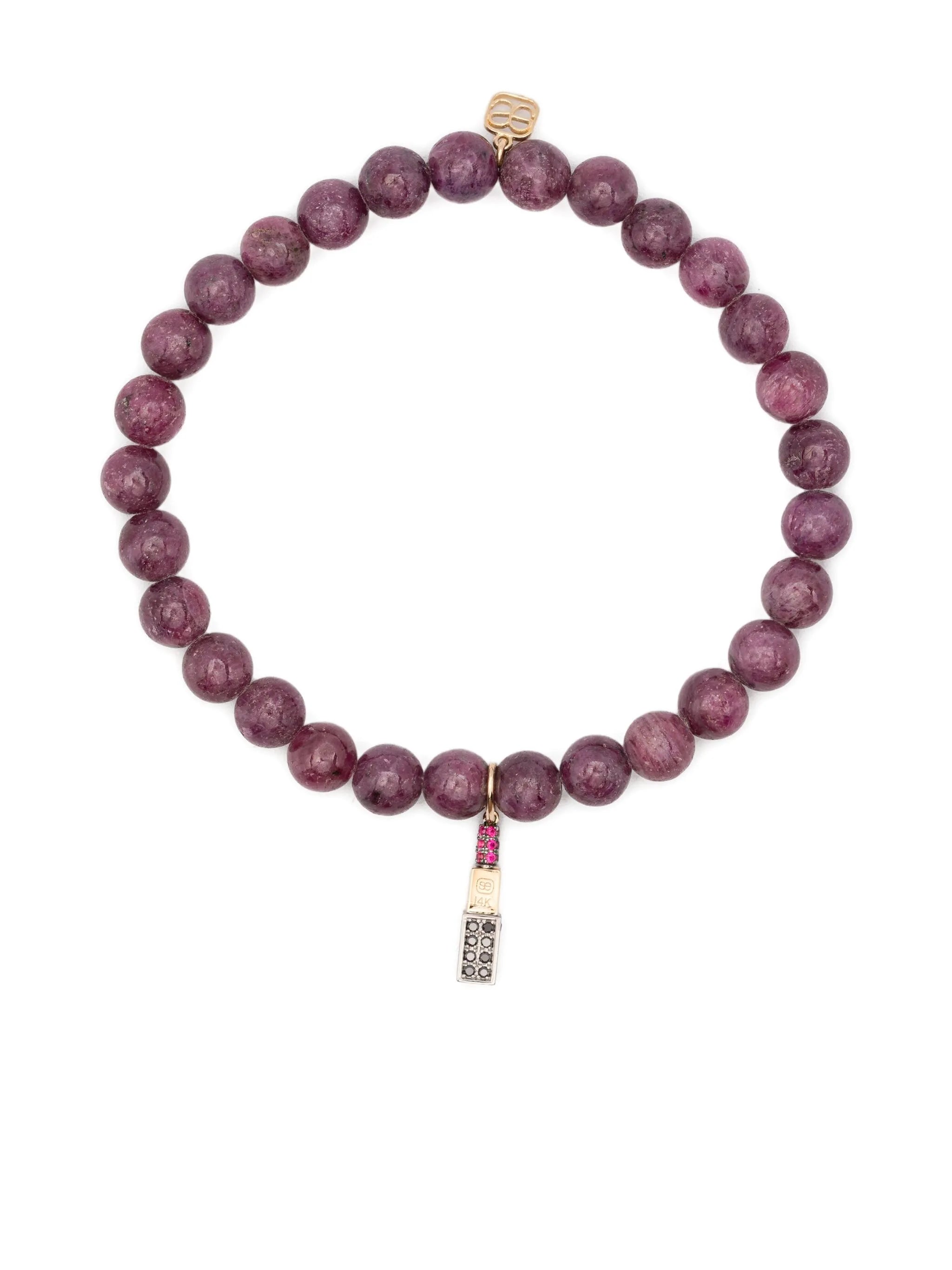 14CT yellow gold diamond and ruby charm bracelet