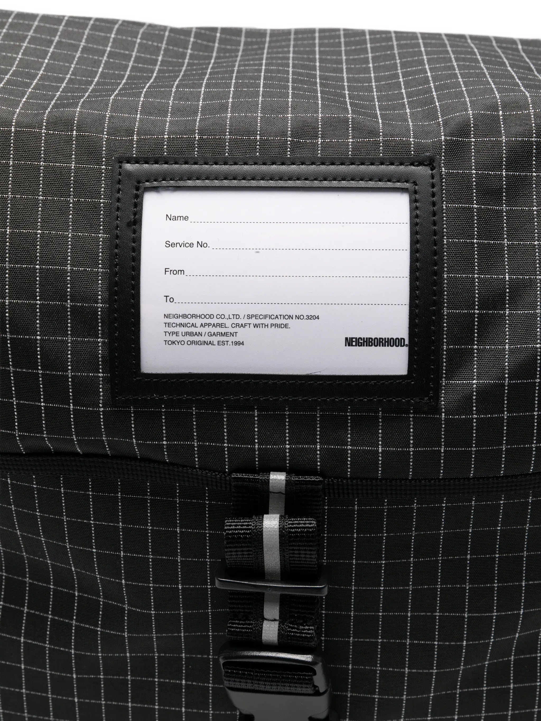 grid-pattern messenger bag