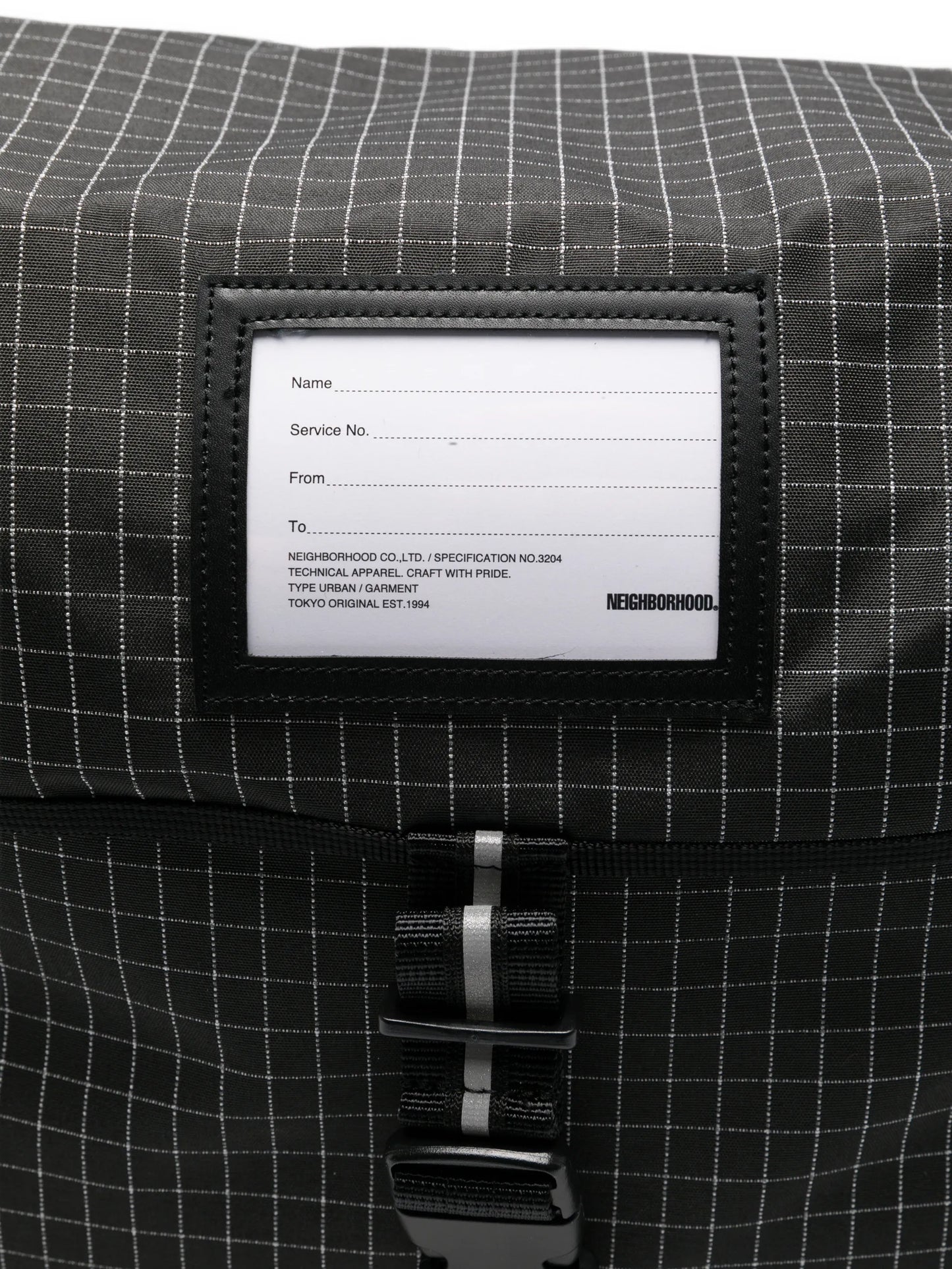 grid-pattern messenger bag