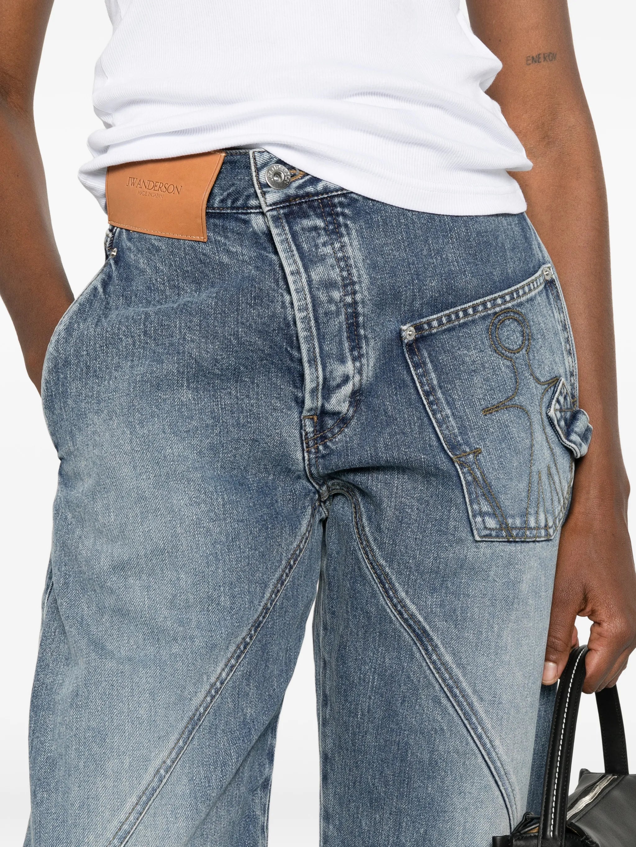 twisted-effect logo-patch denim jeans