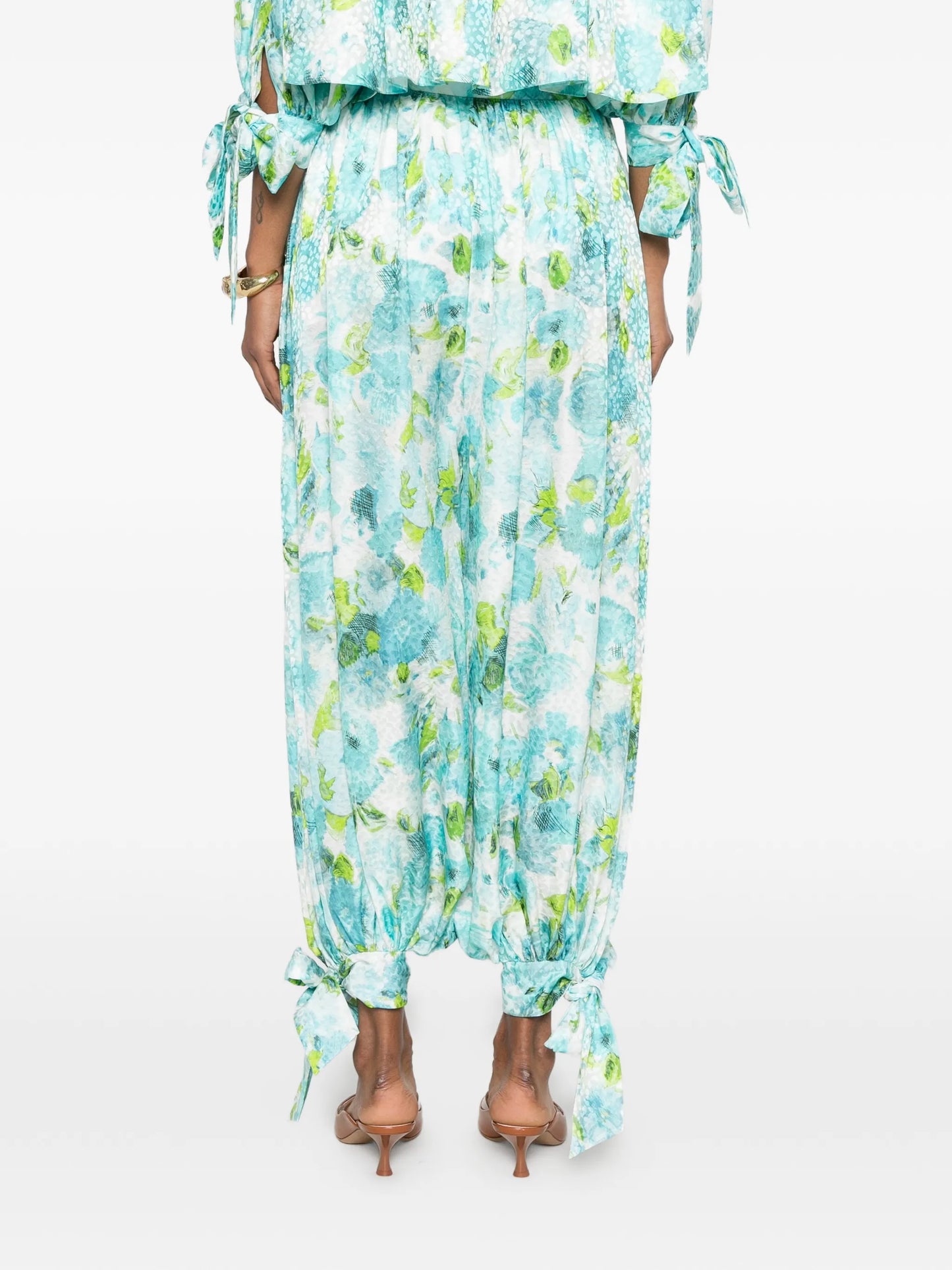 floral-print pleated trousers