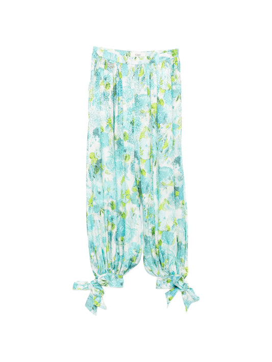 floral-print pleated trousers