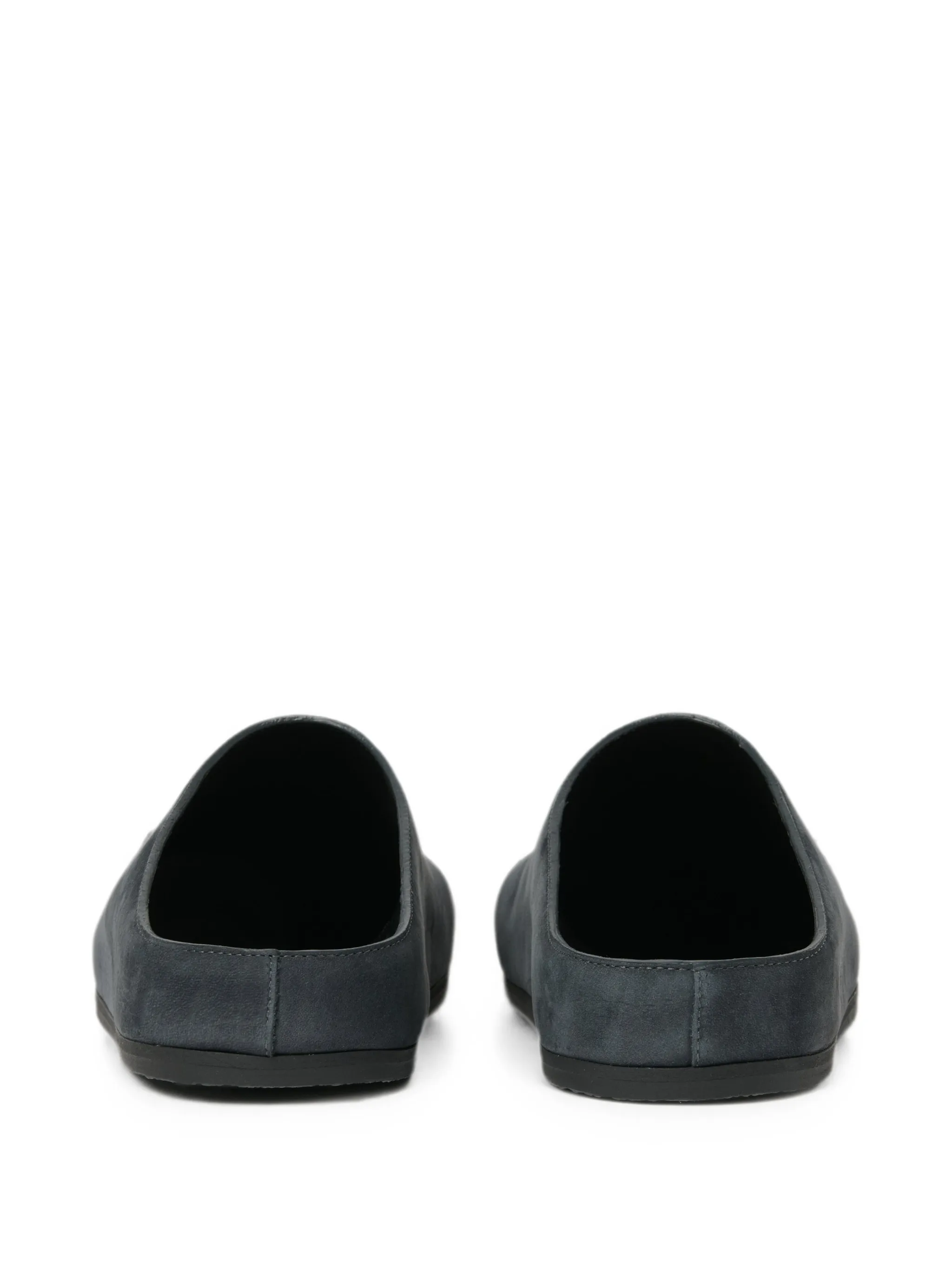 Wearing leather clogs