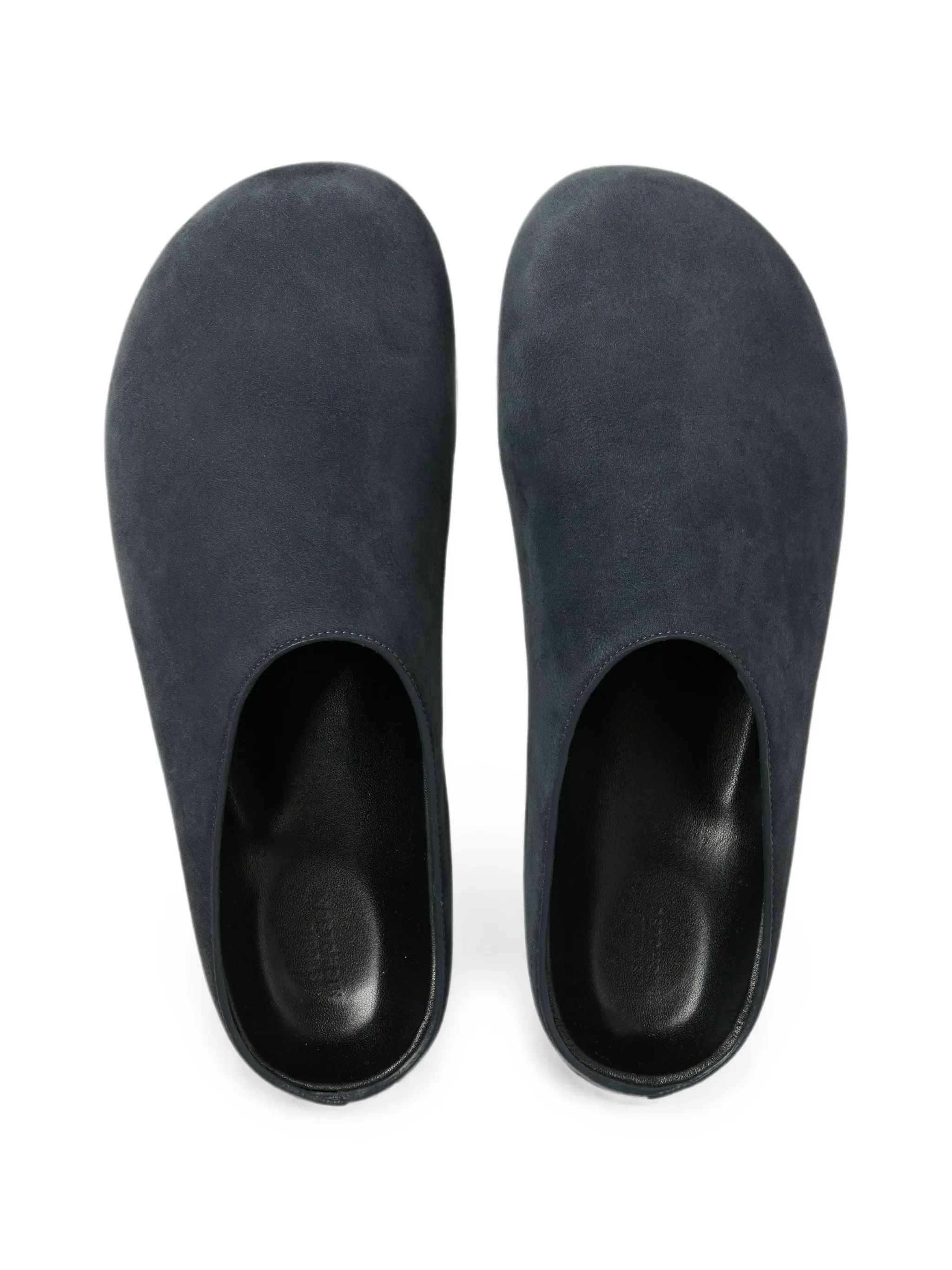 Wearing leather clogs